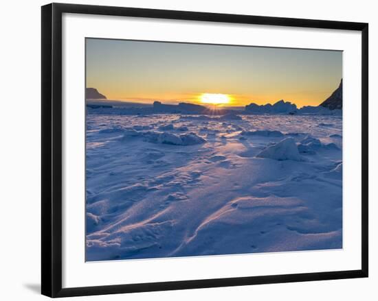 Icebergs frozen into the sea ice of the Uummannaq fjord system during winter. Greenland-Martin Zwick-Framed Photographic Print