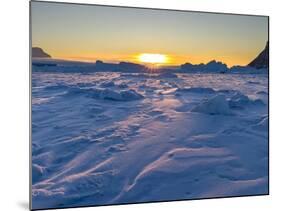 Icebergs frozen into the sea ice of the Uummannaq fjord system during winter. Greenland-Martin Zwick-Mounted Photographic Print