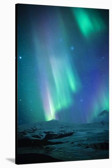 Iceland, Fjallsarlon. the Northern Lights Appearing in the Sky at Fjallsarlon-Katie Garrod-Stretched Canvas