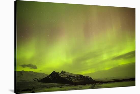 Iceland, Fjallsarlon. the Northern Lights Appearing in the Sky at Fjallsarlonll.-Katie Garrod-Stretched Canvas
