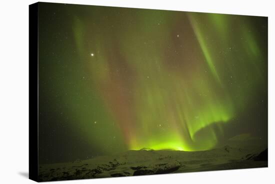 Iceland, Fjallsarlon. the Northern Lights Appearing in the Sky at Fjallsarlonll.-Katie Garrod-Stretched Canvas