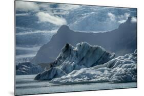 Iceland, floating glaciers in Jokulsarlon, glacier lagoon with mountain echo.-Mark Williford-Mounted Photographic Print