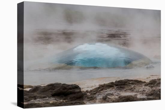 Iceland, Golden Circle, Strokkur Geyser. The Strokkur Geyser erupts with much steam.-Ellen Goff-Stretched Canvas