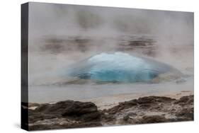 Iceland, Golden Circle, Strokkur Geyser. The Strokkur Geyser erupts with much steam.-Ellen Goff-Stretched Canvas