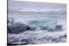 Iceland, Skaftafell National Park, Surf hits glacial ice on a black sand beach.-Ellen Goff-Stretched Canvas