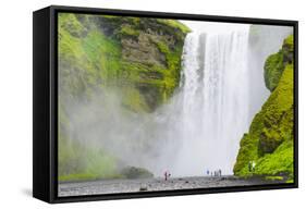 Iceland. South. Skogafoss. Hikers are Skogafoss Waterfall-Inger Hogstrom-Framed Stretched Canvas
