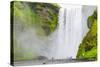 Iceland. South. Skogafoss. Hikers are Skogafoss Waterfall-Inger Hogstrom-Stretched Canvas