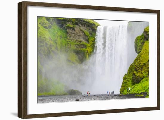 Iceland. South. Skogafoss. Hikers are Skogafoss Waterfall-Inger Hogstrom-Framed Photographic Print