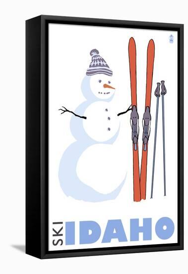 Idaho, Snowman with Skis-Lantern Press-Framed Stretched Canvas