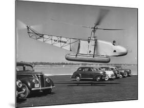 Igor Sikorsky Taking Off in Helicopter from Parking Lot-Dmitri Kessel-Mounted Premium Photographic Print