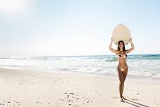 A Beautiful Surfer Girl at the Beach Holding up Her Surfboard-iko-Photographic Print