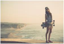 Beautiful And Fashion Young Woman Posing With A Skateboard-iko-Art Print