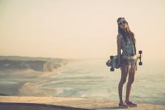 Beautiful And Fashion Young Woman Posing With A Skateboard-iko-Framed Art Print