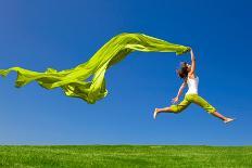 Beautiful Young Woman Jumping On A Green Meadow With A Colored Tissue-iko-Photographic Print