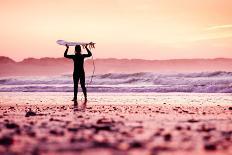 A Beautiful Surfer Girl at the Beach Holding up Her Surfboard-iko-Photographic Print