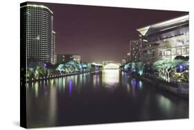 Illuminated architecture and reflections at night in Hangzhou City Center, Hangzhou, Zhejiang, Chin-Andreas Brandl-Stretched Canvas