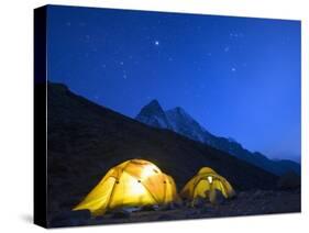 Illuminated Tents at Island Peak Base Camp, Sagarmatha National Park, Himalayas-Christian Kober-Stretched Canvas