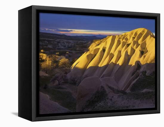 Illuminateded Tuff Stone Erosion with Uchisar, Cappadocia, Anatolia, Turkey-Rainer Mirau-Framed Stretched Canvas