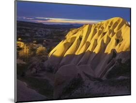 Illuminateded Tuff Stone Erosion with Uchisar, Cappadocia, Anatolia, Turkey-Rainer Mirau-Mounted Photographic Print