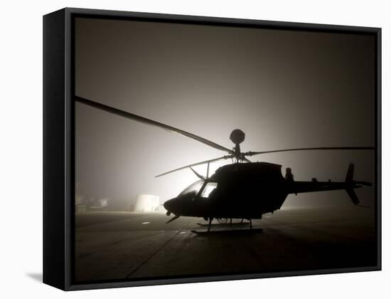 Illumination from the Bright Light Silhouettes of OH-58D Kiowa Helicopter During Thick Fog-Stocktrek Images-Framed Stretched Canvas