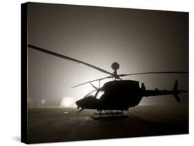 Illumination from the Bright Light Silhouettes of OH-58D Kiowa Helicopter During Thick Fog-Stocktrek Images-Stretched Canvas