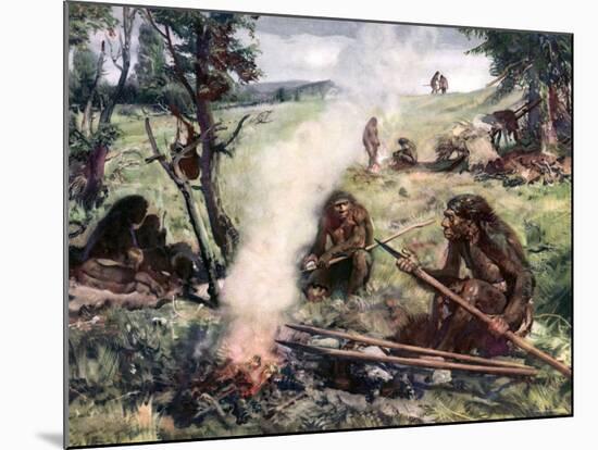 Illustration of Neanderthal Man Sitting Around Fire Holding Lance Like Weapon, Circa 30,000 BC-null-Mounted Photographic Print