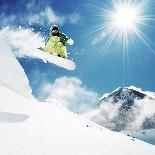 Snowboarder at Jump Inhigh Mountains at Sunny Day.-IM_photo-Photographic Print