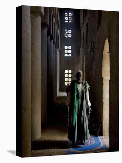 Imam of Kotaka Pauses Beside an Archway Inside the Impressive Mosque on Banks of Niger River, Mali-Nigel Pavitt-Stretched Canvas