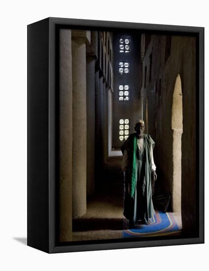 Imam of Kotaka Pauses Beside an Archway Inside the Impressive Mosque on Banks of Niger River, Mali-Nigel Pavitt-Framed Stretched Canvas