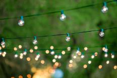 Hanging Decorative Christmas Lights For A Back Yard Party-imging-Framed Photographic Print