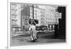 Immigrant Woman Walks Down Street Carrying a Pile of Clothing on Her Head-null-Framed Art Print