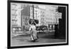 Immigrant Woman Walks Down Street Carrying a Pile of Clothing on Her Head-null-Framed Art Print