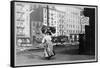 Immigrant Woman Walks Down Street Carrying a Pile of Clothing on Her Head-null-Framed Stretched Canvas