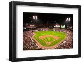 In a night game and a light rain mist, the Florida Marlins beat the 2006 World Series Champion b...-null-Framed Photographic Print