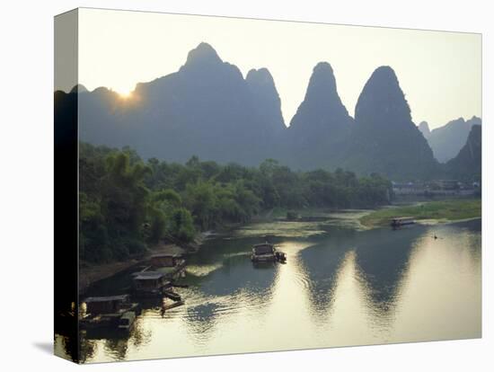 In Guilin Limestone Tower Hills Rise Steeply Above the Li River, Yangshuo, Guangxi Province, China-Anthony Waltham-Stretched Canvas