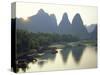 In Guilin Limestone Tower Hills Rise Steeply Above the Li River, Yangshuo, Guangxi Province, China-Anthony Waltham-Stretched Canvas