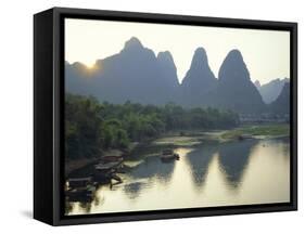 In Guilin Limestone Tower Hills Rise Steeply Above the Li River, Yangshuo, Guangxi Province, China-Anthony Waltham-Framed Stretched Canvas