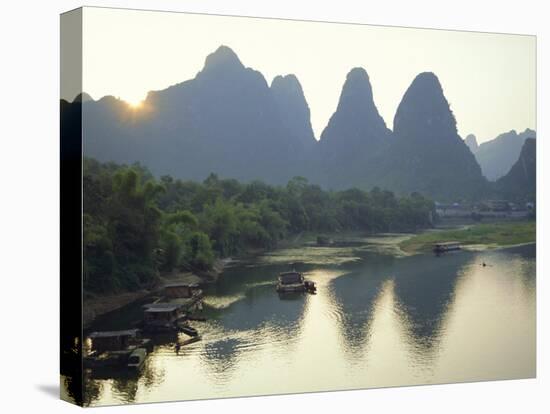 In Guilin Limestone Tower Hills Rise Steeply Above the Li River, Yangshuo, Guangxi Province, China-Anthony Waltham-Stretched Canvas