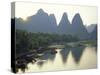 In Guilin Limestone Tower Hills Rise Steeply Above the Li River, Yangshuo, Guangxi Province, China-Anthony Waltham-Stretched Canvas