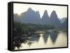 In Guilin Limestone Tower Hills Rise Steeply Above the Li River, Yangshuo, Guangxi Province, China-Anthony Waltham-Framed Stretched Canvas