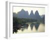 In Guilin Limestone Tower Hills Rise Steeply Above the Li River, Yangshuo, Guangxi Province, China-Anthony Waltham-Framed Premium Photographic Print