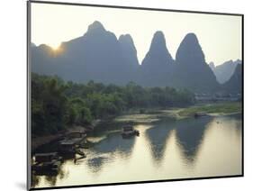 In Guilin Limestone Tower Hills Rise Steeply Above the Li River, Yangshuo, Guangxi Province, China-Anthony Waltham-Mounted Photographic Print