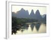 In Guilin Limestone Tower Hills Rise Steeply Above the Li River, Yangshuo, Guangxi Province, China-Anthony Waltham-Framed Photographic Print