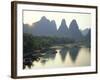 In Guilin Limestone Tower Hills Rise Steeply Above the Li River, Yangshuo, Guangxi Province, China-Anthony Waltham-Framed Photographic Print