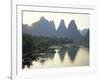 In Guilin Limestone Tower Hills Rise Steeply Above the Li River, Yangshuo, Guangxi Province, China-Anthony Waltham-Framed Photographic Print