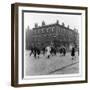 In Liverpool, a Lollipop Lady Helps Children Cross a Cobbled Street-Henry Grant-Framed Photographic Print