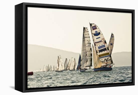 In the start of the yachting regatta Centomiglia in 2012 in front of the harbour of Bogliaco, Lake -Rasmus Kaessmann-Framed Stretched Canvas