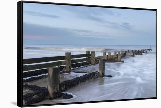 Incoming waves hitting a groyne at Walcott, Norfolk, England, United Kingdom, Europe-Jon Gibbs-Framed Stretched Canvas