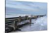 Incoming waves hitting a groyne at Walcott, Norfolk, England, United Kingdom, Europe-Jon Gibbs-Stretched Canvas