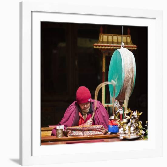 India, Ladakh, Hemis, Monk Reciting Prayers to the Slow Rhythm of a Drum at Hemis Monastery-Katie Garrod-Framed Photographic Print